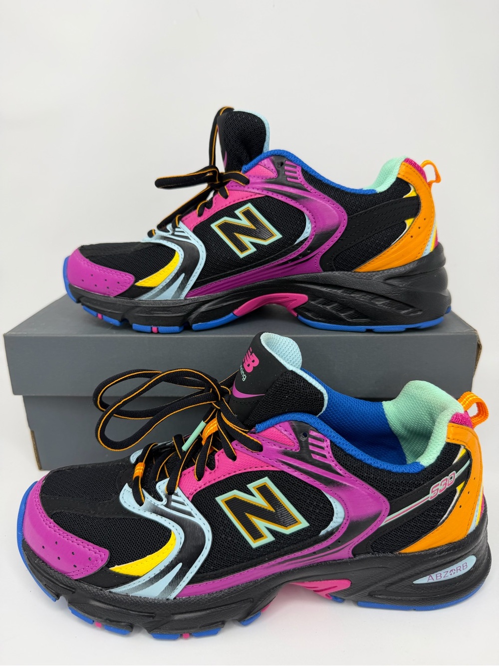 New Balance Kids Black Sneakers with Purple, Orange & Yellow Accents